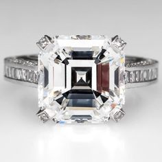 an emerald cut diamond ring with baguetts