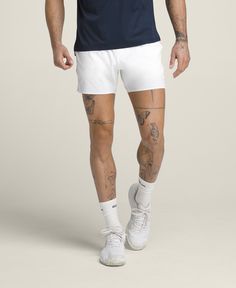 Sometimes it's not just about facing your opponent, but also the weather. The Tournament Short is Wilson's lightest-weight, on-court short for hot days. Ultralight and airy, the stretchy fabric is perforated for ventilation. The knit waistband has a mesh-like texture and a built-in drawcord, so it keeps a strong hold without feeling restrictive. Unlined and designed to pair with your favorite compression liner. | Wilson Men's Tournament Short 5" Wilson Sporting Goods, Tennis Shorts, Recycled Polyester Fabric, Mens Sportswear, Athletic Fits, Hot Days, Stretchy Fabric, Mens Bottom, Mens Shorts