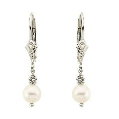 "Such a fabulous pair of freshwater cultured white pearl dangle earrings hand set in 14K white gold. The white gold leverback settings have a nicely detailed vintage style appearance that works very well with the pearls and yellow gold bead cluster. Vintage look earrings are a nice size with a total drop of 28.5mm from top to bottom ( 1 1/8\" drop). Pearl size is 5.5 - 5.8mm (1/4\") in diameter. Excellent pearl quality with good luster, silky appearance, and great surface condition. Unique pair Classic Pearl Charm Jewelry For Anniversary, Classic Jewelry With Pearl Charm For Anniversary, Pearl White Jewelry For Formal Occasions, Graceful Pearl White Earrings For Formal Occasions, Graceful White Dangle Jewelry, Formal Round Pearl Earrings With Lever Back Ear Wires, White Gold Pearl Dangle Jewelry, Formal Round Pearl Earrings With Lever Back, White Gold Dangle Jewelry With Pearl Charm