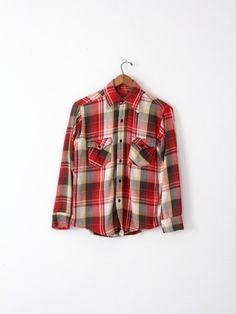 1970sThis is a vintage unmarked Big Mac flannel shirt. The heavy-weight cotton button down shirt features a red, gold, black and white plaid. The pockets on the chest have the classic Big Mac contrasting bias cut plaid. • unmarked Big Mac shirt• button down• red plaid• cotton flannel shirt• pockets on chestCONDITIONIn good condition with natural wear. Approximate Fit: MediumMEASUREMENTSBust:            21.5" (43)   ...     54.6 cm (109.2)Length:        28"             ...      71.1 cmShoulders: Retro Cotton Flannel Shirt For Fall, Vintage Flannel Button-up Shirt, Vintage Plaid Shirt With Pockets, Retro Cotton Flannel Shirt For Winter, Vintage Plaid Flannel Shirt With Pockets, Vintage Plaid Cotton Flannel Shirt, Vintage Cotton Flannel Shirt For Winter, Retro Plaid Flannel Top, Vintage Collared Flannel Shirt