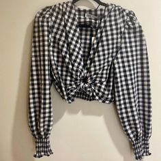 Black And White Gingham Long Sleeve Blouse With Puffy Sleeves And Smock Trim. Deep V Neckline With An Open Circle Knot Detail In The Center. Really Flattering. Never Worn New With Tags. Size Small. Chic Gingham Long Sleeve Tops, Fall Gingham V-neck Top, Gingham V-neck Top For Day Out, Chic Gingham V-neck Blouse, Spring Gingham V-neck Blouse, Chic Plaid Blouse For Picnic, Plaid Long Sleeve Blouse For Day Out, Chic Gingham Blouse For Brunch, Trendy Fitted Gingham Blouse