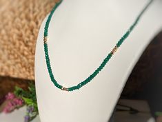 This stunning Emerald bead necklace captures the essence of the May birthstone and its coveted properties of Love and Friendship.Each necklace is lovingly crafted - one bead at a time - each bead radiating a unique shade of green, symbolizing growth and harmony.Let the captivating beauty of this natural Emerald necklace be a meaningful symbol for your beloved, your best friend, or for yourself - of the precious relationships that enrich our lives.T H E ∙ S M A L L ∙ D E T A I L S• Natural Emeral Green Emerald Beaded Necklaces For May Birthstone, Green Emerald Beaded Necklace For May Birthstone, Gift Polished Beads Emerald Necklace, Polished Emerald Beaded Necklaces, Faceted Round Emerald Bead Necklace, Handmade Gemstone Jewelry, Natural Gemstone Necklace, Love And Friendship, Emerald Bead