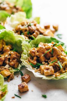 lettuce wraps filled with meat and garnishes