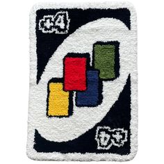 a rug with the letter c on it and blocks in different colors, including blue, green, yellow, red, white