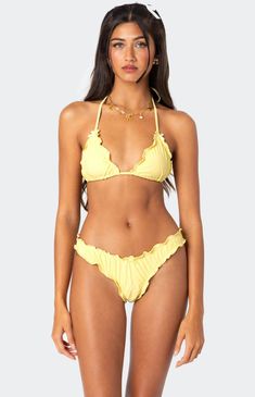 This Edikted Gold Ruffle Edge Triangle Bikini Top with ruffle edge detailing is a great choice for feeling snatched and comfortable. This girly and flirty style swimsuit is the perfect choice to wear all summer long. Bikini topTriangle fitAdjustable halter & back tiesRuffle edge detailingBow detailingDouble lined stretch fabricNylon, SpandexModel wears size SModel height is 5'6Item care: Hand wash in cold water, do not soak, do not bleach, do not tumble dry, do not wring or twist, line drying in the shade, do not iron, do not dry clean. Edikted Womens Golden Ruffle Edge Triangle Bikini Top - Yellow size Large Flirty Style, Visionary Fashion, Yellow Swimsuits, Modest Swimsuits, Modest Swimwear, Swimsuits High Waisted, Cute Swimsuits, Swimwear Tops, Model Height