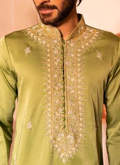 Presenting raihbar kurta with embroidered mandarin collar and detailed hand embroidered scattered detailing on all over the kurta elevated with beads, thread, sequence, cutdana work with inside lining. Cotton Silk Bandhgala With Resham Embroidery, Festive Cotton Silk Sherwani With Embroidery, Bollywood Style Embroidered Cotton Silk Bandhgala, Eid Cotton Silk Bandhgala With Dabka Work, Cotton Silk Kurta With Dabka Work In Traditional Drape, Traditional Drape Kurta With Dabka Work In Cotton Silk, Long Sleeve Cotton Silk Sherwani With Intricate Embroidery, Cotton Silk Bandhgala With Dabka Work, Diwali Cotton Silk Bandhgala With Intricate Embroidery