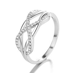 The Sterling Silver Intertwined Ring with Swarovski® Crystals is a stunning and unique piece of jewelry that combines the beauty of sterling silver with the sparkle of Swarovski crystals. The ring features two intertwined bands that are made of high-quality sterling silver, which gives the ring a sleek and polished look that is both elegant and sophisticated. The intertwining bands of the ring are embellished with crystals from Swarovski, which are finely crafted and polished to a high shine. Th Intertwined Ring, Crystal Colors, Flat Wedges, Elegant Ring, Sterling Silver Bands, Center Stage, Polished Look, Silver Band, Eternity Ring