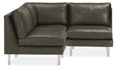 a brown leather couch sitting next to each other