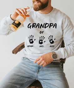 Celebrate your love for your grandkids with this cozy "Grandpa of" sweatshirt, custom-made with their names beneath adorable handprints, making it a sweet and personal keepsake for any proud grandfathers. This sweatshirt is the perfect Christmas gift for grandpas. Please enter all names that are to be displayed as hands. if you want to swap the top name, simply enter it in the personalization. ♥ Please note on dark sweatshirts the print will be white and on light sweatshirts the print will be bl Sweatshirt Diy, Diy Sweatshirt, Grandpa Sweater, Custom Sweatshirts, Grandpa Gifts, Perfect Christmas Gifts, Perfect Christmas, Cake Ideas, Personalized Custom