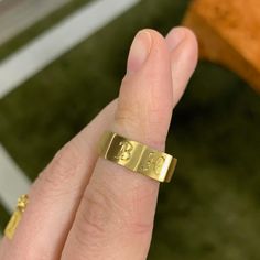 Like a band unearthed from centuries past, the faceted Ode Ring is fully customizable with hand-engraved lettering. Prounis jewels are made with a custom shade of the ancient 22-karat alloy. Each piece begins with a soft matte finish, and over time the wearer�s skin will polish the metal, creating a lustrous velvety shine. Matte Gold Brass Jewelry For Anniversary, Symbolic Hand Forged Engraved Ring As Gift, Symbolic Hand-forged Engraved Ring As A Gift, Symbolic Hand Forged Engraved Ring For Gift, Engraved Wide Band Heirloom Jewelry, Heirloom Wide Band Engraved Jewelry, Engraved Brass Open Ring Jewelry, Yellow Gold Engraved Initial Ring For Promise, Symbolic Yellow Gold Engraved Promise Ring