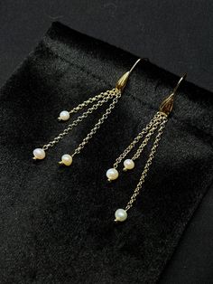 Handmade natural Fresh Water Pearl Drop Earrings. Material: 18k Gold Gemstone: Natural Fresh Water Pearls Drop length: 7.5 Centimetres;  They will definitely add glamour to you whenever you wear them. The colour and shine will be retained for years to come. They are perfect as a gift or as a treat for yourself. ------- ------- YenLing is a brand that specialises in designing fine jewellery and elegant lifestyles. Each of our pearls is carefully selected and each piece of jewellery is handcrafted by professional and diversity-focused designers. We want you to have joy and fond memories of wearing our jewellery. It is for this purpose that the brand YenLing will continue to explore the path of elegance and aesthetics. ------- ------- Shipping Next Day & 48H Delivery Service ------- ------- T Elegant Pearl Chain Chandelier Earrings As Gift, Elegant Chandelier Earrings With Pearl Chain, Delicate Pearl Chain Earrings For Gift, Pearl Chandelier Earrings With Pearl Chain As Gift, Yellow Gold Pearl Drop Dangle Chandelier Earrings, Elegant Long Drop Pearl Earrings As Gift, Elegant Long Drop Pearl Earrings For Gift, Pearl Pendant Dangle Earrings For Anniversary, Delicate Pearl Drop Chandelier Earrings As Gift