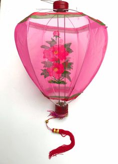 a hot air balloon decorated with pink flowers