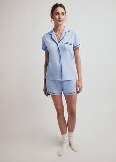 Cut from a soft cotton, The Favorite PJs blends a classic fit with contrast piping (and Favorite Daughter pocket embroidery, of course). The two-piece set has button-front top with short sleeves and elastic waist bottoms. Sweet dreams sold separately.100% CottonGaby is 5'9" wearing size Small Classic Cotton Sets With Relaxed Fit, Blue Collared Sets With Pockets, Light Blue Cotton Short Sleeve Sets, Classic Relaxed Fit Short Sleeve Sets, Light Blue Short Sleeve Summer Sleepwear, Blue Collared Cotton Sleepwear, Cotton Short Sleeve Sets For Daywear, Light Blue Cotton Short Sleeve Sleepwear, Classic Short Sleeve Sets For Spring