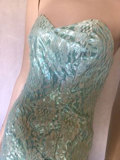 Vtg 80s strapless sea green full length party cocktail formal dress mermaid hemline 8 Pre-owned. 9/10. Freshly hand washed.  Colour is stunning The base of this dress is a wonderful foaming sea green colour acetate fabric. With a creamy off white lace overlay. Bodice is figure fitting. Entry is via a rear zip Bodice is boned, quite structured. The asymmetric skirt is similar construction with a diagonal sea green piping across the front waist accentuated with a decorative bow  Sleeveless Fully l Green Strapless Mermaid Dress For Party, Strapless Green Mermaid Party Dress, Strapless Green Mermaid Dress For Party, Formal Mermaid Dress With Spaghetti Straps For Prom, Strapless Mermaid Dress For Evening And Party Season, Formal Spaghetti Strap Mermaid Dress For Prom, Green Mermaid Evening Dress, Green Strapless Mermaid Dress, Summer Evening Mermaid Dress With Fitted Bodice