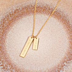 Show off your special memories and milestones with this beautiful Coordinate Date Bar Necklace. Handcrafted in golden tones, this sophisticated piece of jewelry is the perfect way to keep your treasured memories close to your heart. Surprise your loved one with this meaningful and lasting gift. Available in 14k gold plated, rhodium plated or 14k rose gold plated brass Large Bar: 1/4" by 1 1/4"; Small Bar: 1/4" by 3/4" 16" cable chain with 2" extender Lobster claw closure With engraving this item Personalized Gold Necklaces, Meaningful Gold Necklace For Personalized Gift, Meaningful Personalized Gold Necklace, Gold Rectangular Necklace For Keepsakes, Gold Rectangular Pendant Necklace For Keepsake, Gold Rectangular Keepsake Necklace, Meaningful Gold Necklace For Anniversary, Gold Minimalist Necklace For Keepsake, Meaningful Gold Birthstone Necklace