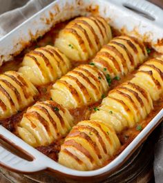 a casserole dish filled with ravioli and cheese