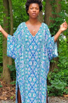 Our timeless Obaatan Kaftan embodies elegant comfort and divine femininity. Made from the most lustrous bamboo rayon, this luxurious fabric offers a modern yet feminine feel and is flattering on every figure. With its draped silhouette and fluid, feminine shape, it is the ultimate in comfort and style, in our eclectic butterfly inspired print, this is the throw on dress you'll wear again and again. Bohemian Rayon Tunic For Beach, Flowy Rayon Kaftan For Beachwear, Beach Kaftan With Kimono Sleeves In Rayon, Rayon Tunic Maxi Dress For Vacation, Tunic Rayon Maxi Dress For Vacation, Bohemian Flowy Dress With Side Slits, Flowy Bohemian Dresses With Side Slits, Flowy Rayon Maxi Dress With Kimono Sleeves, Bohemian Dress With Rayon And Kimono Sleeves