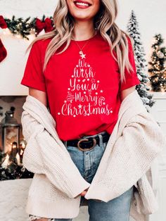 👕 Spread holiday cheer with this festive Bella Canvas 3001 T-shirt, featuring the text "We Wish You A Merry Christmas" arranged in a tree shape. Made from 100% Airlume combed and ring-spun cotton, this shirt offers a lightweight, breathable feel, perfect for staying comfortable at Christmas gatherings, holiday parties, or cozy winter days.  👕 Merry Christmas Shirt With a classic crew neckline and retail fit, it's stylish for both casual and semi-formal settings. The fun and festive design make Jesus Christmas Shirt, Christmas Shirt Women, Happy New Year Shirt, New Year Shirt, Cross Shirt, Jesus Christmas, Cross Shirts, New Years Shirts, Merry Christmas Shirts