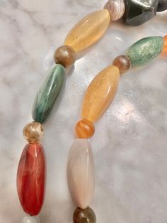 Vintage Agate, Carnelian, Jade, Jasper, Bloodstone, mixed beaded, hand-knotted necklace, in many sizes and shapes with spherical spacer stones; approx 42" long. This is an unusual and rare, handmade necklace. CONDITION: minor wear and use consistent with age and use. Please see the photos for condition. We can send you more photos if you need them. Will send within 24-48 hours Multicolor Large Beads Agate Necklace, Multicolor Agate Large Beaded Necklaces, Multicolor Agate Beaded Necklace With Large Beads, Multicolor Carnelian Necklaces With Polished Beads, Multicolor Agate Necklaces With Large Beads, Multicolor Hand-strung Agate Beaded Necklaces, Multicolor Carnelian Beaded Necklace With Large Beads, Multicolor Agate Beaded Necklaces With Oval Beads, Multicolor Carnelian Beaded Necklaces With Large Beads