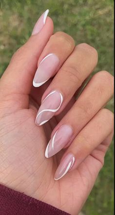 a woman's hand with white and pink manies on it