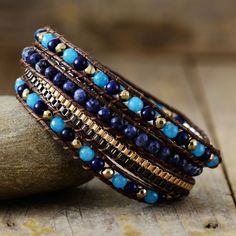 Introducing the Ethnic Blue Chic Wrap Bracelet, a stunning accessory that brings beauty and harmony to your daily life. Crafted with high-quality gemstones, this bracelet exudes a sense of elegance and sophistication, making it a perfect complement to any outfit. Not only does it enhance your appearance, but it also promotes balance and positive energy flow throughout your body. *Material: Jasper, Lapis Lazuli, Jade, Wax rope, Metal *Making Technics: Handmade Sewed *Size: 32.5 inches, 3 closures Jasper Lapis, Energy Flow, Inner Peace, Positive Energy, Lapis Lazuli, Wrap Bracelet, Jewelry Inspiration, Daily Life, Hand Weaving