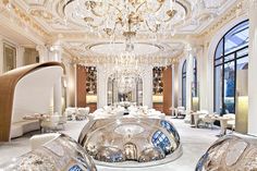 an elaborately decorated dining room with chandeliers