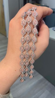 3.98 Carat total weight Natural pink pear shapes F/G color white diamonds VS-SI clarity Set in 18K White Gold 7 inches Exceptional Craftsmanship Pink Diamond Bracelet, Pear Shapes, Rare Colors, Baddie Makeup, Pear Shaped Diamond, Diamond Bracelets, Indian Jewellery, Pink Diamond, Vintage Diamond