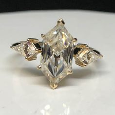 a fancy ring with three stones on it