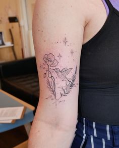 a woman with a tattoo on her arm