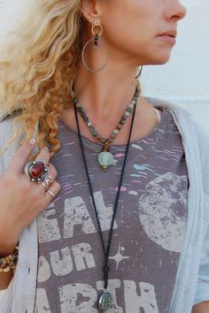 Spirit Lala Vintage Coin: Recycled Glass Bead Drop Necklace ♡ Product Highlights ♡ Our Spirit Lala Vintage Coin: Recycled Glass Bead Drop Necklace is the perfect accessory to add to any on-trend bohemian style outfit! Layered and paired with any of our many statement necklaces, earrings, and bracelets, of your choosing, the Spirit Lala Vintage Coin: Recycled Glass Bead Drop Necklace will be sure to be a wonderful addition to any necklace layering style! ✁ Contents & Measurements ✁ Our Spirit Lal Hippie Beaded Pendant Jewelry, Hippie Style Beaded Pendant Jewelry, Bohemian Green Crystal Necklaces With Gemstone Beads, Turquoise Bohemian Beaded Necklaces For Layering, Turquoise Bohemian Beaded Necklace For Layering, Spiritual Beaded Jewelry With Recycled Glass, Bohemian Turquoise Necklaces For Layering, Green Bohemian Hand Wrapped Necklace, Bohemian Green Hand Wrapped Necklace