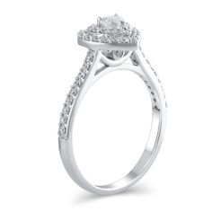 Steal her heart with the romantic details of this charming diamond engagement ring. Crafted in cool 10K white gold, this look showcases a 1/6 ct. heart-shaped diamond sparkling in a double diamond-lined frame. The shank shimmers with diamonds while hidden bezel-set diamonds adorn the gallery. Captivating with 1/2 ct. t.w. of diamonds and a bright polished shine, this engagement ring suits her sweet style. White Diamond Heart Ring With Halo Setting, White Diamond Heart Ring With Diamond Cut, Luxury Heart Cut Diamond Ring With Halo Design, Diamond Heart Ring With Halo Design, White Diamond Heart Ring For Proposal, White Diamond Heart Ring With Brilliant Cut, Elegant White Heart Ring With Halo Setting, White Heart-shaped Diamond Ring For Formal Events, White Heart Ring With Halo Setting For Promise