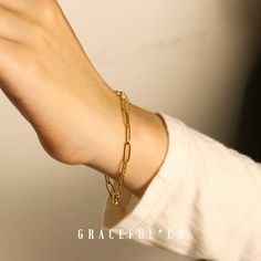 Whether you’re in the market for a standout piece or a dainty addition to your jewelry box, the Paperclip Bracelet has you covered. This elegant chain is available in gold and silver to make your bracelet dreams come true. Material Titanium Steel, Hypoallergenic, Waterproof, Suitable for Sensitive Skin. Description Adjustable Length: 20cm extension (8 inches) (Adjustable) Thickness: 0.65mm Closure: Lobster Clasp Our jewelry is packed in a delicate jewelry bag and stunning gold embossed gift box. Elegant Chain Bracelet With Paperclip Chain, Minimalist Metal Bracelets For Gifts, Minimalist Metal Bracelets As Gift, Minimalist Metal Bracelet For Gift, Elegant Gold Plated Paperclip Chain Bracelet, Elegant Paperclip Bracelet With Delicate Chain As Gift, Elegant Paperclip Bracelet With Delicate Chain For Gift, Minimalist Metal Chain Bracelet With Oval Links, Elegant Metal Paperclip Bracelets