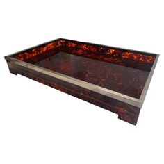 a brown and black tray sitting on top of a table