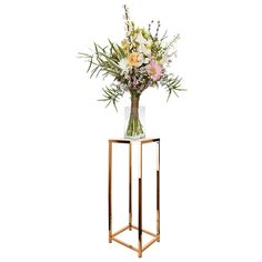 a vase filled with flowers sitting on top of a metal stand