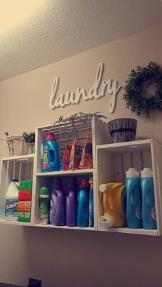 the shelves are filled with cleaning products and laundry detergents, including one that says laundry