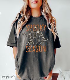 Cute Spooky Season T-shirt ,Halloween Skeleton Dancing Shirt, Womens Halloween Tshirt, Cute Fall Tee, Gift For Halloween, Retro Halloween 👉 ABOUT  Dancing Skeleton Comfort Colors® 1717 Shirt - 100% Airlume combed and ringspun cotton - Soft cotton and quality print make users fall in love with it over and over again. - These t-shirts have-ribbed knit collars to bolster shaping. - Printed and shipped from the USA CARE INSTRUCTIONS - Wash inside out with like colors. - Tumble dry or hang to dry. - Horror Themed Short Sleeve T-shirt For Fall, Spooky Pre-shrunk T-shirt For Fall, Spooky Skull Print Tops For Fall, Spooky Skull Print Fall Top, Fall Skull Print Short Sleeve Tops, Spooky Halloween T-shirt With Graphic Print, Spooky Short Sleeve T-shirt For Fall, Spooky Crew Neck Top For Halloween, Spooky Short Sleeve Top With Screen Print