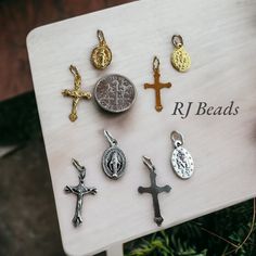 "◆ These small charms are perfect for making Catholic jewelry such as bracelets, earrings, pendants, keychains and more! ◆ Each set includes 2 gold and 2 oxidized silver Miraculous Medal charms, 2 gold and 2 oxidized silver crosses. Total of 8 pieces. ◆ Made in Italy. Jump rings included ◆ Miraculous medal charms measure approximately: 1/2\" long (not including the jump ring) Crucifixes measure approximately: 3/4\" long (not including the jump rings) 🚀 FREE SHIPPING ON ORDERS OVER $35! 🚀 Order Handmade Adjustable Charms For Jewelry Making, Adjustable Pendant Charms For Jewelry Making, Spiritual Vintage Charms For Jewelry Making, Dainty Charm Necklaces With Miraculous Medal As Gift, Spiritual Dangle Charms Nickel Free, Catholic Jewelry Bracelets, 14k Gold Spiritual Miraculous Medal Jewelry, Nickel Free Dangle Spiritual Charms, Nickel-free Spiritual Jewelry And Charms For Jewelry Making