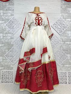 Beautiful Ethiopian and Eritrean Habeshan Dress. Stylish Menen, 100% Cotton We recommend hand washing and air drying to make it last longer. A low heating iron will also keep design and look. Beautiful Habeshan Dress |Ethiopian Traditional Dress|Eritrean Dress|Habesha Kemis|Zuria|Habesha Chiffon|Kemis Festive Tunic Dress With Traditional Patterns, Elegant Red Dress With Traditional Patterns, Red Bohemian Dress For Transition Seasons, Bohemian Red Dress For Seasonal Wear, Ceremonial Long Sleeve Festive Dress, White Anarkali Silk Dress, Red Maxi Dress For Eid, Festive Tunic Dress For Traditional Ceremonies, Ceremonial Red Dress With Traditional Patterns