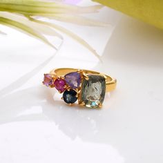 Make a splash with this beautiful prong set multi sapphire  gemstone ring in 925 silver and yellow gold rhodium plated (nikle free). all are products are handmade,absolutely new and unworn . ѻ Gemstone : Natural multi colour sapphires  ѻ Metal : Sterling Silver with yellow gold rhodium plating  ѻ Gemstone Size : multiple                               ѻ Current ring size Available : US 7 ѻ Gemstone Cut : full cut multiple fancy shapes  All of our jewelry are made with handpicked semiprecious stones and gemstones.  Due to the nature of these semiprecious stones a slight variation in colors may be noticed between the pictures and the real piece. Although we guarantee that this is barely noticeable.  Real Gemstones and semiprecious stones naturally consists of inclusions.  In other words these Multicolor Sapphire Gemstone Ring, Gold Multi-stone Pink Sapphire Ring, Fine Jewelry Pink Sapphire Ring With Gemstone Accents, Gold Rings With Multi-stone Pink Sapphire, Luxury Multi-stone Sapphire Ring With Tourmaline, Yellow Sapphire Birthstone Ring, Multi Colored Engagement Rings, Green Sapphire Ring, Multi Gemstone Ring