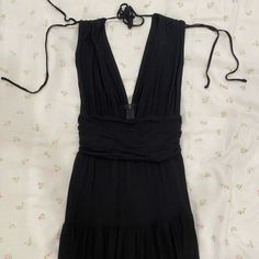 Never Worn Evening Black Maxi Dress With Tie Back, Black Halter Neck Maxi Dress With Tie Back, Sleeveless Black Mini Dress With Tie Back, Chic Black Halter Neck Mini Dress, Black Backless Maxi Dress With Tie Back, Black Summer Mini Dress For Party, Black Summer Party Mini Dress, Black Mini Dress With Tie Back For Spring, Black Mini Dress For Party