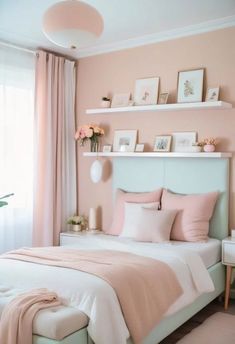 a bedroom with pink walls and white furniture