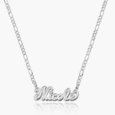 Our popular Double Plated Iced Out Script Name Necklace boasts a chic and elegant design, handcrafted to perfection. The model showcases the necklace with an 18-inch Cuban chain (see image for reference). Chain width:Cuban Chain - 3.7 mmFigaro Chain - 3 mmRope Chain - 2.3 mm Closure: All chains are fitted with a lobster clasp. Metal Selection: Gold Plated Silver Plated Sterling silver 14k gold plated over sterling silver 14k solid gold - (NAMEPLATE ONLY) Engraved Sterling Silver Chain Necklace For Anniversary, Anniversary Engraved Sterling Silver Chain Necklace, White Gold Necklace With Figaro Chain Link, Silver Figaro Chain Necklace Gift, Elegant Personalized Sterling Silver Chain Necklace, Elegant Personalized Link Necklaces, Personalized Sterling Silver Chain Necklace, Elegant Silver Charm Necklace With Curb Chain, Sterling Silver Pendant Name Necklace With Adjustable Chain