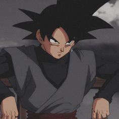 the young gohan is sitting down with his hands on his hips