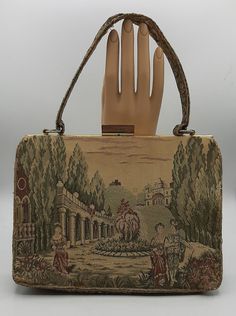 "Vintage Handbag by La Marquise Fine ItalianTapestry Purse 2 Inside Pockets A gorgeous vintage bag, measures 9 1/2\" x 7\" x 3\". The tapestry shows a detailed court yard with two females and a man.  Many stories can be thought about with this purse. Opens and closes easily and the zipper works just fine inside. Gently pre-owned in good vintage condition.  There is some wear on the corners and the top of the handle was coming apart and it looks like it was sewed a bit. Check out my store at #Fun Court Yard, Black Beret, Vintage Handbag, Top Handle Bags, Vintage Bag, Newsboy Cap, Vintage Handbags, Vintage Bags, Purses And Handbags