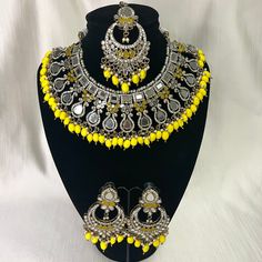 Tyaani inspired Yellow Silver Mirror Indian / Pakistani Jewellery Set - Necklace and Earrings & Tikka. Sabyasachi inspired Lightweight and comfortable. We have a large inventory - message us what shade you are looking for or send picture of your outfit to match. Fast shipping - Canada & USA "Life is better ... with a Touch of Elegance". Message for any questions. Festive Yellow Jewelry With Intricate Design, Yellow Chandbali Jewelry With Intricate Design, Yellow Chandbali Jewelry For Celebration, Handmade Yellow Bollywood Jewelry, Temple Jewelry Style Bridal Necklace In Yellow, Yellow Temple Jewelry Bridal Necklace For Festivals, Yellow Chandbali Temple Jewelry, Yellow Temple Jewelry For Festivals, Yellow Bohemian Jewelry For Wedding