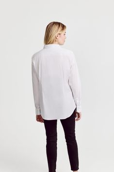 The Icon Shirt runs tailored at the waist, chest and back.  For a contemporary fit, order true size.  For a blousier fit, size up, or consider The Boyfriend Shirt for an even looser look.

 Our perfect fit cotton stretch button down. We designed our best-selling Icon Shirt to be fitted throughout, giving you a body-hugging shape yet eliminating blouse gape completely.  Our cotton stretch is sourced from a family-run mill in Spain and produced in our factory in Portugal by a local team of artisan Icon Shirt, The Boyfriend, Boyfriend Shirt, The Shirt, Shirtdress, Bye Bye, Color White, Perfect Fit, Spain