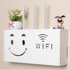 a white wifi box with a smiley face on it