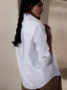 A mainstay in anyone's wardrobe, this classic shirt is cut with ease for a relaxed look and crafted from a cotton poplin that's specially washed for added softness.  Point collar.  Button front.  Shirttail hem.  Classic-Fit: Fitted shoulder relaxed t Hair Couler, Petite Size, Curator Style, Classic Shirt, Hip Length, Shirt White, Cotton Poplin, Workout Shirts, Banana Republic