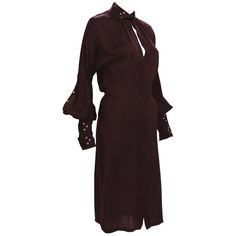 Tom Ford for Gucci Silk Dress 2003 Collection Italian Size 40 - US 4 100% Silk Color - Deep Burgundy Hidden Button Closure at Front Sleeves Finished with Triple Buckle and Grommet Bands Made in Italy. Excellent Condition. Gucci Silk V-neck Dress, Long Sleeve Gucci Dresses For Fall, Chic Gucci Midi Dress For Workwear, Designer Long Sleeve Dresses With Button Closure, Elegant Gucci Midi Dress For Work, Gucci Midi Evening Dress, Gucci Evening Midi Dress, Gucci Long Sleeve Silk Dress, Gucci Midi Length Evening Dress