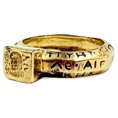 Rare and highly unusual Ancient Greek style 14K yellow gold and enamel octagonal shape amulet signet ring Provenance: Private Maine collection The complex, octagonal shaped band of this beautiful ring is composed of three surface sides to each of the eight sides with enamel inscriptions in Greek, twenty four inscriptions in all. The front square signet depicts the face of a bearded man surrounded by inscriptions in Greek. Signet rings with enamel details are rarely seen, most are either done entirely in gold or are centered by gemstones. Size: 8.25 US Signet: 8mm by 8mm Width side to side: 23mm Condition: Very Good, light surface wear commensurate with age, lovely patina. Tested for 14K gold Weight: 6.8 grams Symbolic Formal Jewelry With Etched Details, Formal Symbolic Etched Jewelry, Ceremonial Symbolic Etched Jewelry, Ancient Style Yellow Gold Brass Jewelry, Symbolic Ceremonial Ring, Symbolic Ceremonial Etched Jewelry, Ancient Ceremonial Hallmarked Jewelry, Symbolic Etched Jewelry For Ceremonial Occasions, Rectangular Gold Ceremonial Jewelry